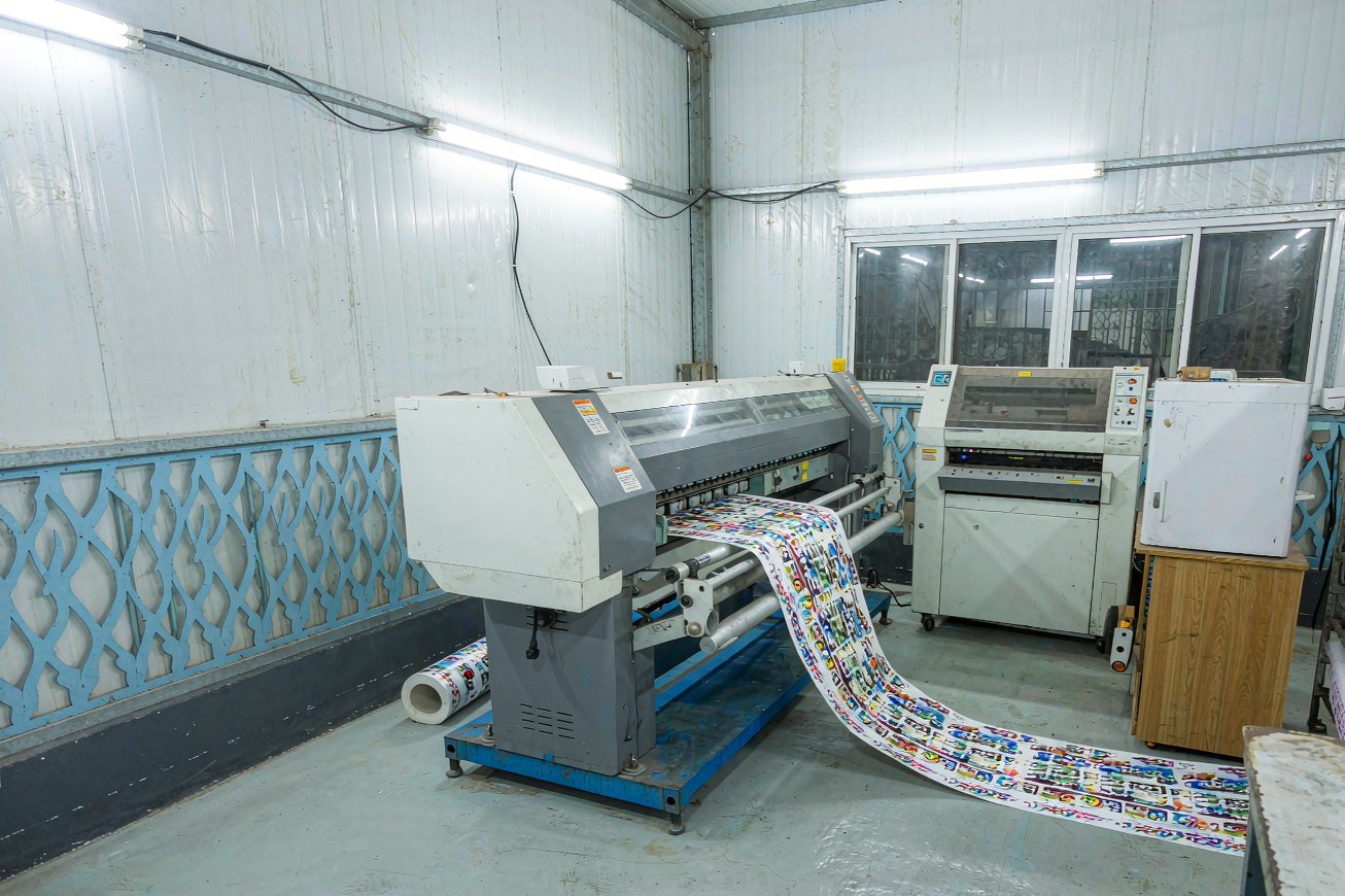 Inside the printing workshop — press and finishing area