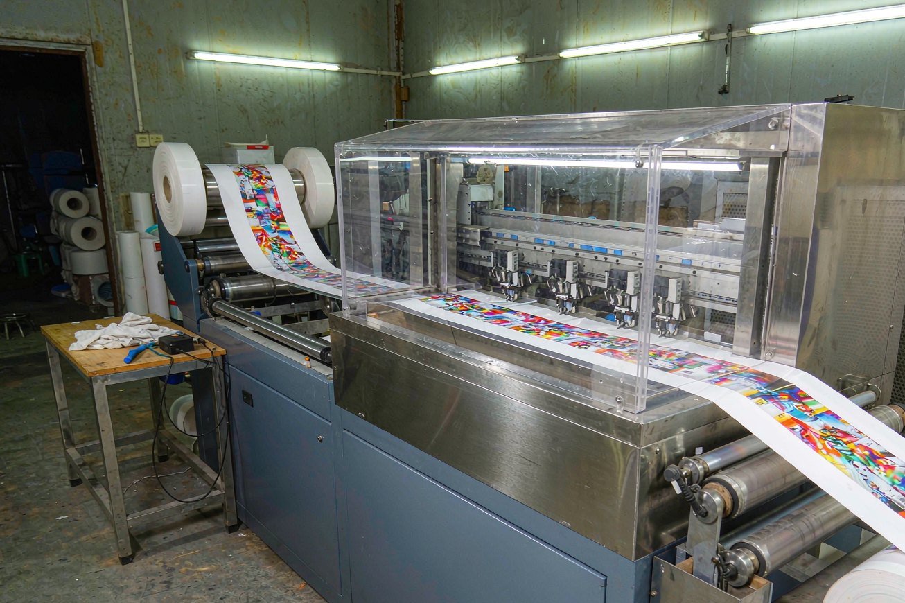 Printheads laying colour onto film in the printing workshop